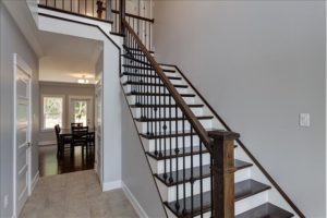 Craftsman newel post metal balusters and single left miter stair treads